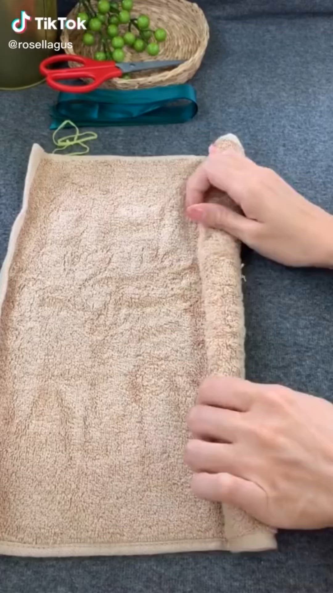 This may contain: someone is making a rug with scissors and yarn