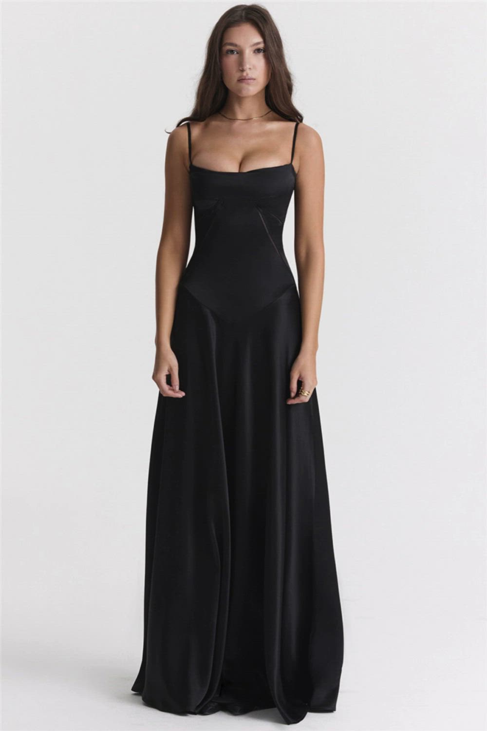 This contains: As a product expert, I present to you this elegant Lace-Up Satin Maxi Slipdress for women. Embrace comfort and style with a spaghetti strap design, lace-up details, and a backless cut. Perfect for club or evening parties, this black dress is a must-have in every femme's wardrobe.