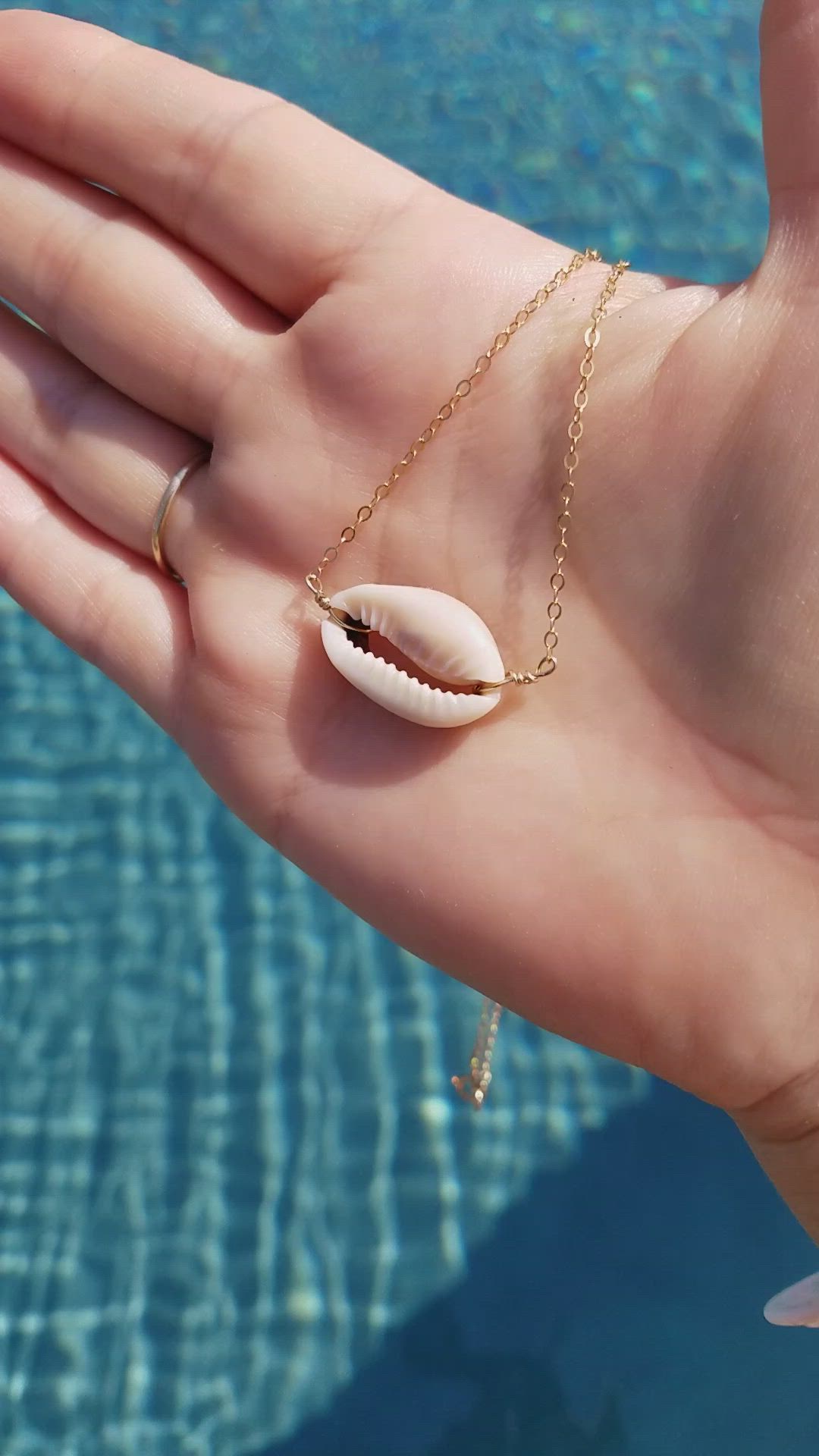 Want 20% off? Enter surfergirl during checkout. #shopsmall This is a cowrie shell necklace made in 14k gold-fill that is 16 inches. It is the perfect layering necklace for your bikini or new summer outfit. It also makes a great gift!