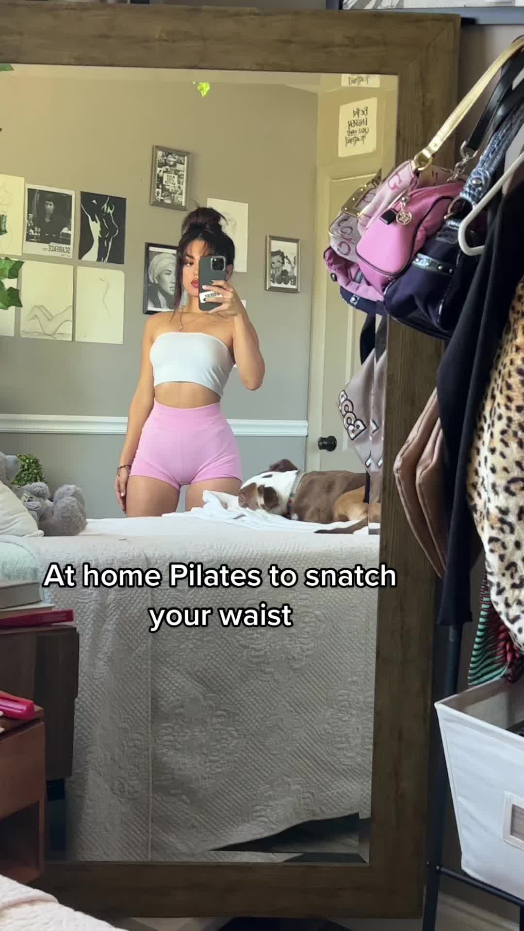 This may contain: a woman taking a selfie in front of a mirror with the caption at home plates to snatch your waist