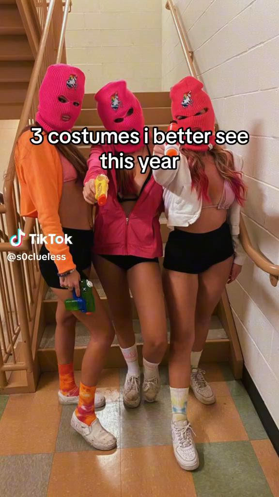 This may contain: three girls wearing pink hats and black shorts are standing in front of stairs with the caption 3 costumes i better see this year pt 1 trio edition