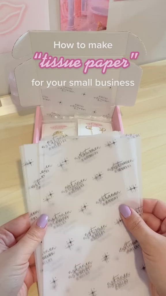 This may contain: a person holding up some paper with writing on it and the words how to make tissue paper for your small business