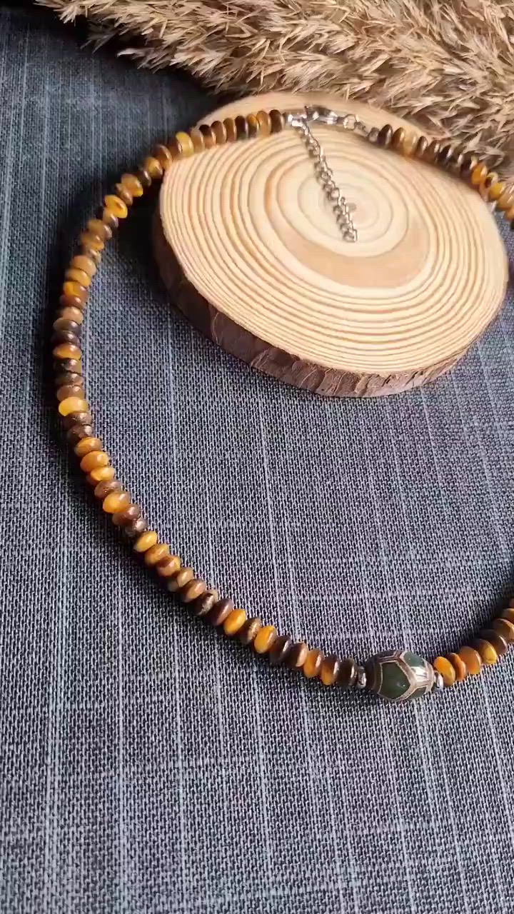 Beautiful, elegant minimalist boho Tibetan Dzi Turtle choker necklace for men and women. This beautiful Feng Shui amulet is made of tiger's eye rondelles and green Tibetan agate barrel Dzi Turtle. It is a modern and stylish talisman for success, good luck, money, health and protection. Perfect for everyday wear, or as a gift for birthday or any holiday. Please follow us for updates on: Instagram, Pinterest and Tik Tok @lovely_gemstones #menchoker #womenchoker #Dzinecklace #DziTurtle #TigersEye #protectionnecklace #fengshuiamulet #giftformen #giftforwomen #brownandgreen