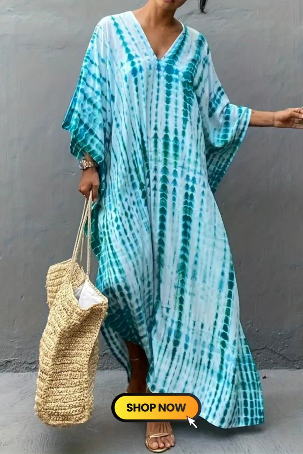 The V Neck Oversized Kaftan Dress embodies bohemian ease. This loose, airy dress, perfect for beach vacations, features a relaxed fit and a free-spirited V-neck design. With its flowing silhouette, it captures the essence of boho chic, making it an ideal choice for laid-back, yet stylish, beach getaways.