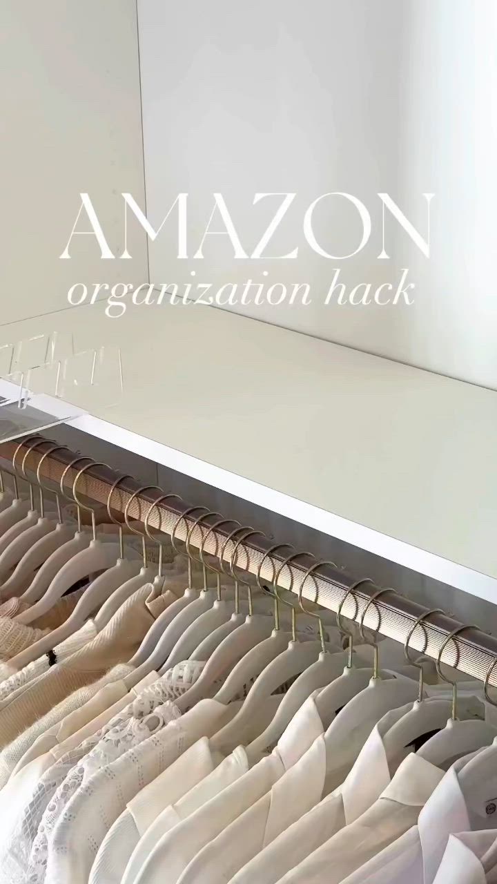 This may contain: an organized closet with clothes hanging on hangers and the words amazon organization hack above it