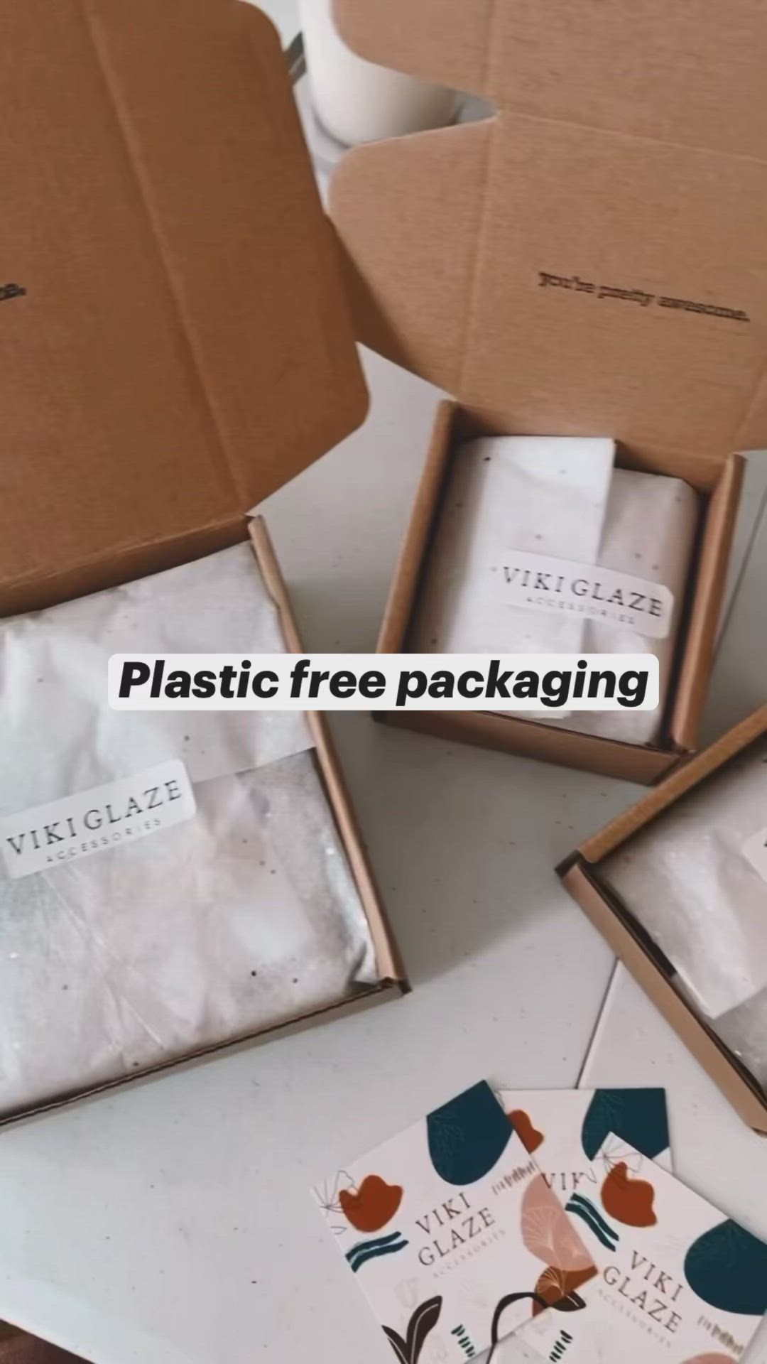 This may contain: three boxes with different designs on them sitting next to each other and the words plastic free packaging