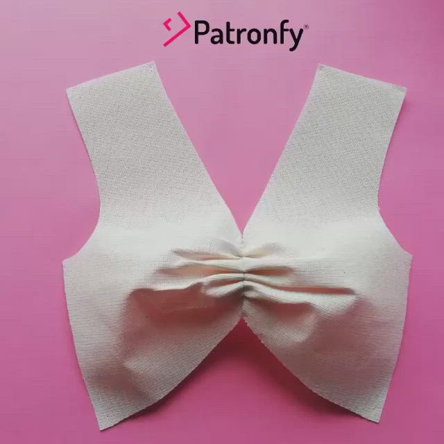 This may contain: an image of a white bow on a pink background with the words patronfy above it