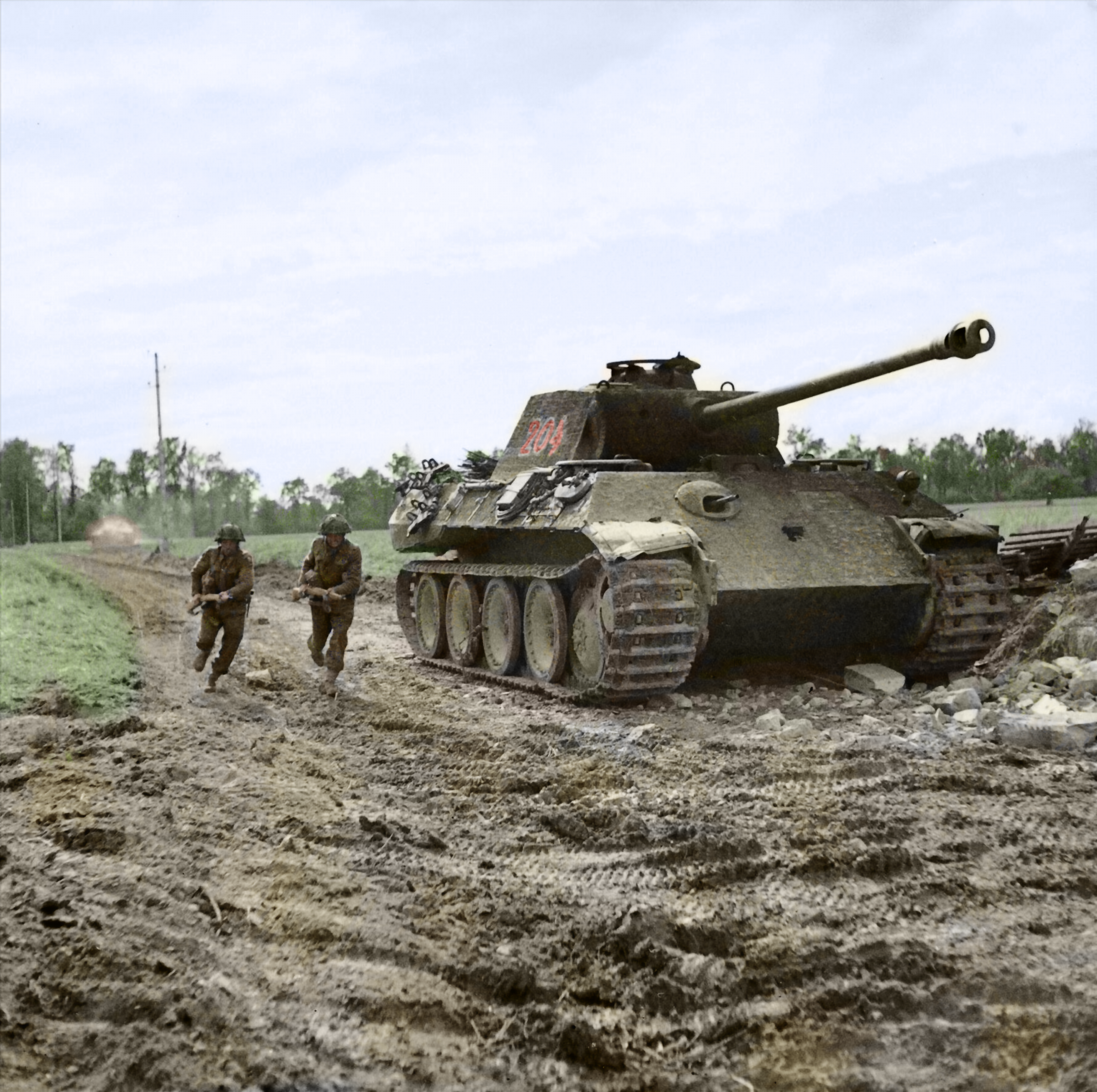 Men of the Durham Light Infantry, 49th (West Riding) Division, run past ...