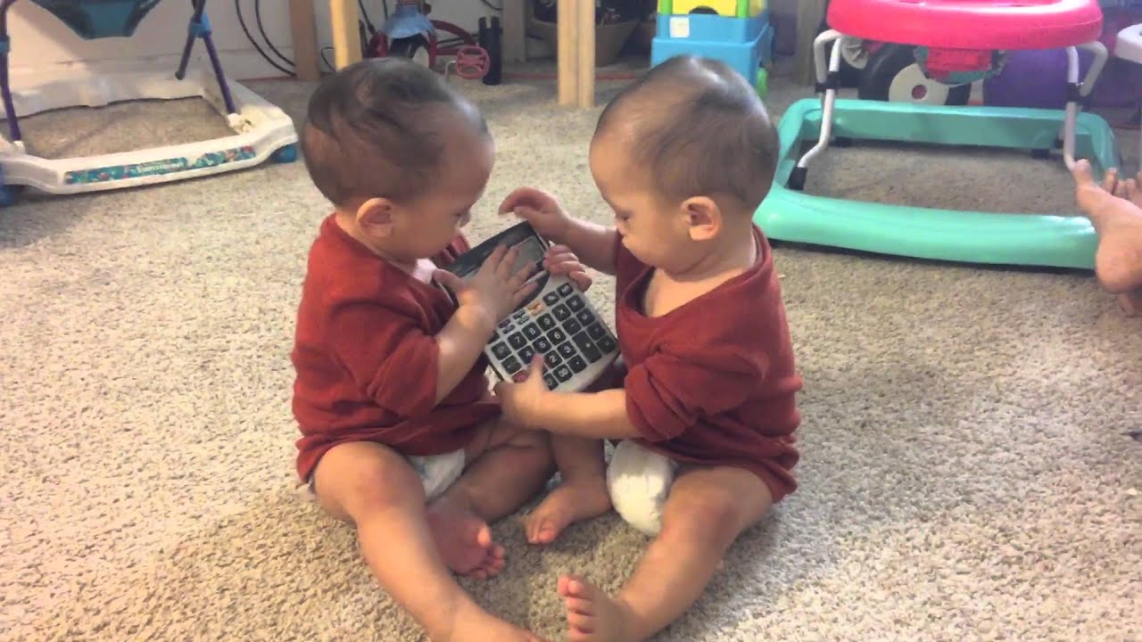 Twin babies fighting for a calculator! - YouTube