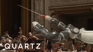 A robot conducts an orchestra