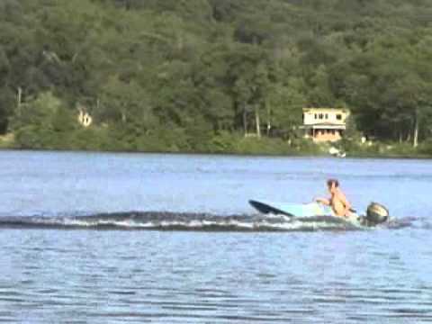 a 10hp 1953 scott atwater outboard powering 1960's