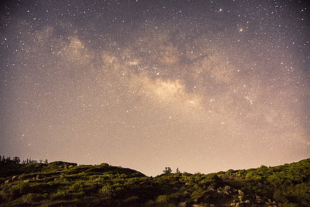 nebula over green field