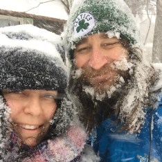 Speakeasy Travel Supply Founders Bethany Salvon and Randy Kalp smiling in a snow storm.