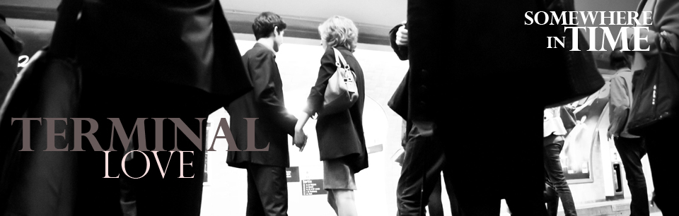 A couple standing in a Paris Metro Station.