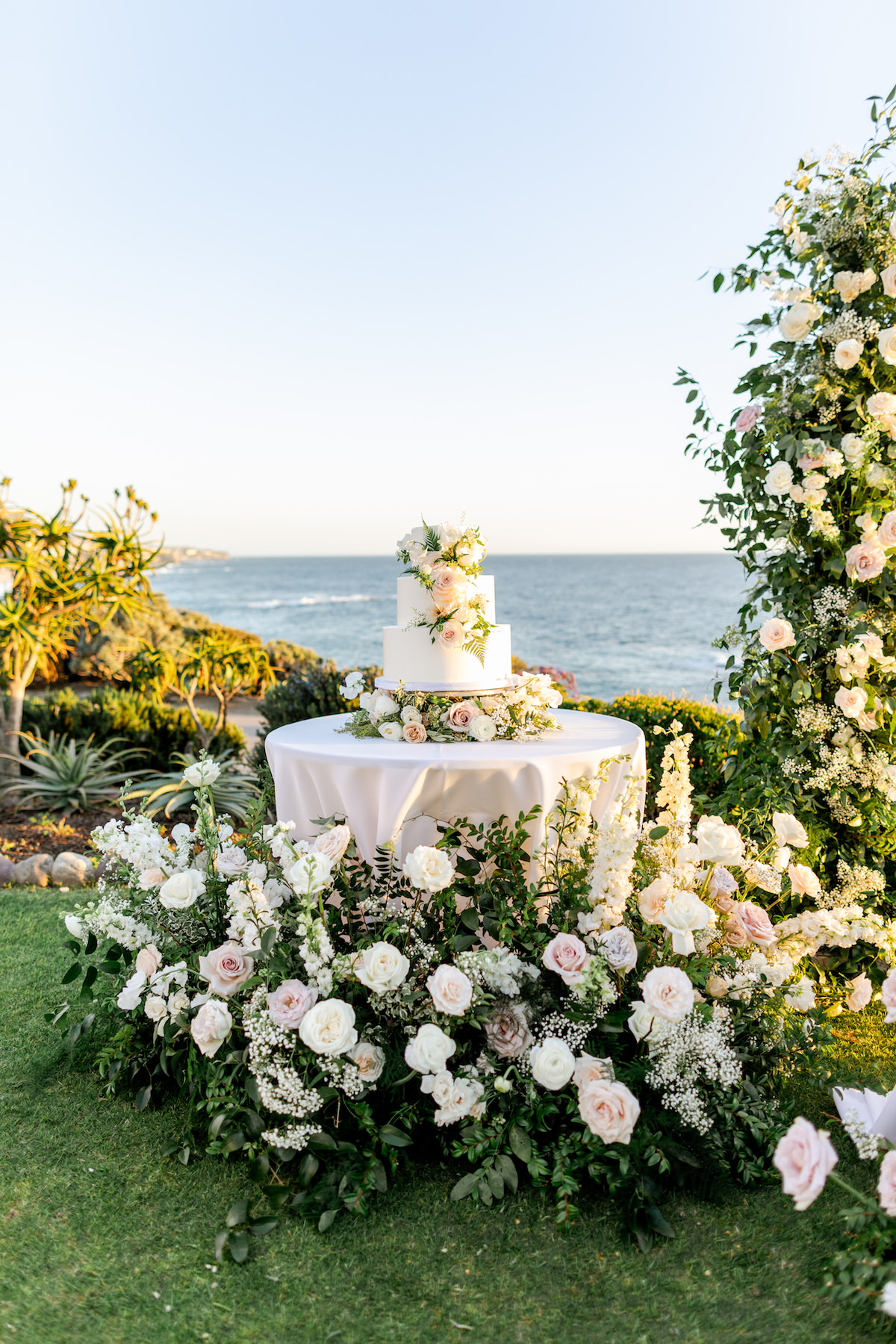 Luxury Wedding cake table decorated with flowers - Holly Sigafoos Photo