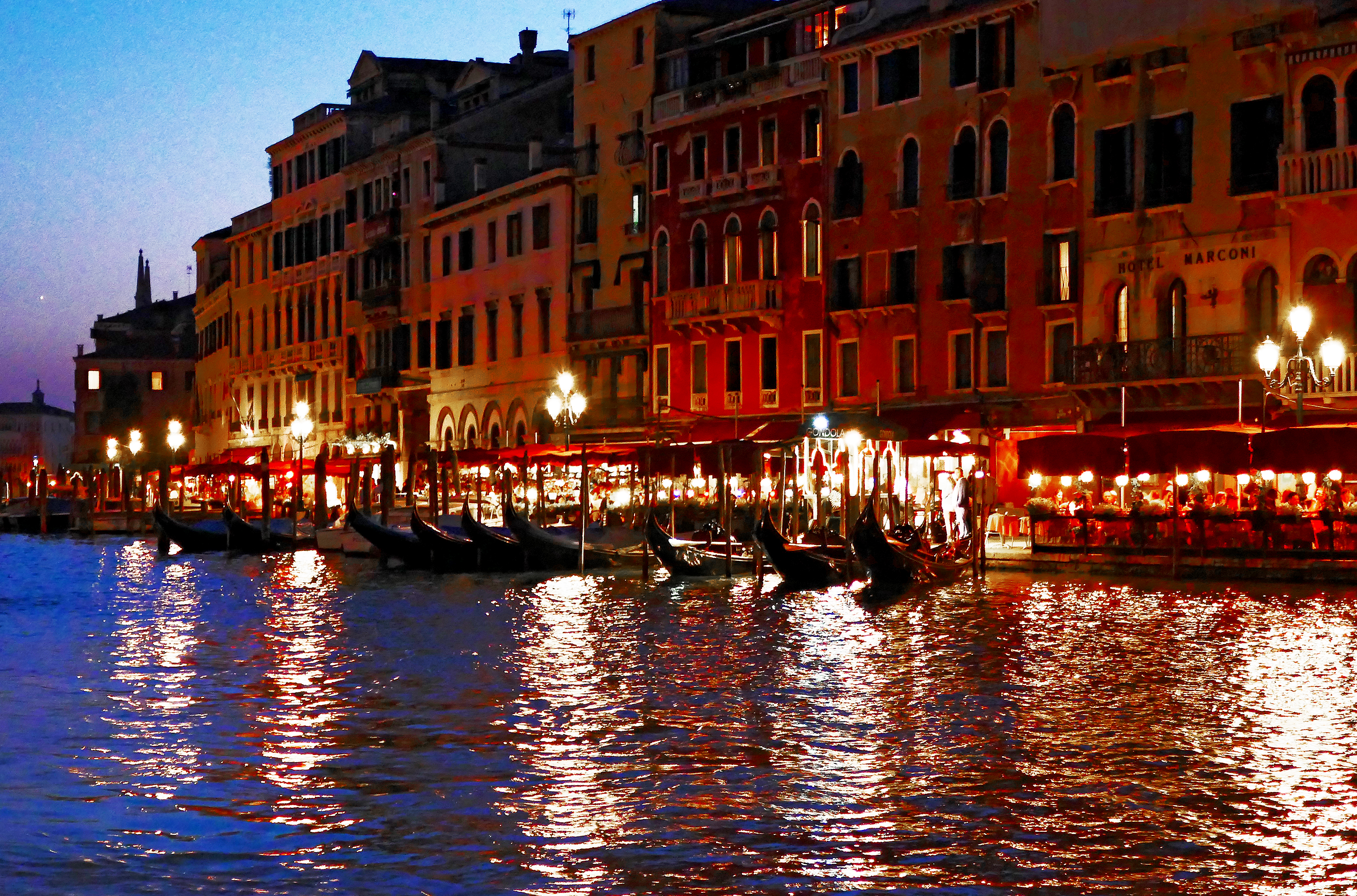 Venice canal at night with boomervoice.ca