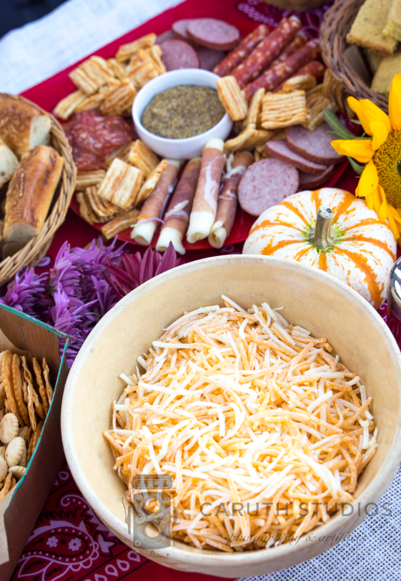 bowl of cheese topping next to meat and cheese try and pumpkins