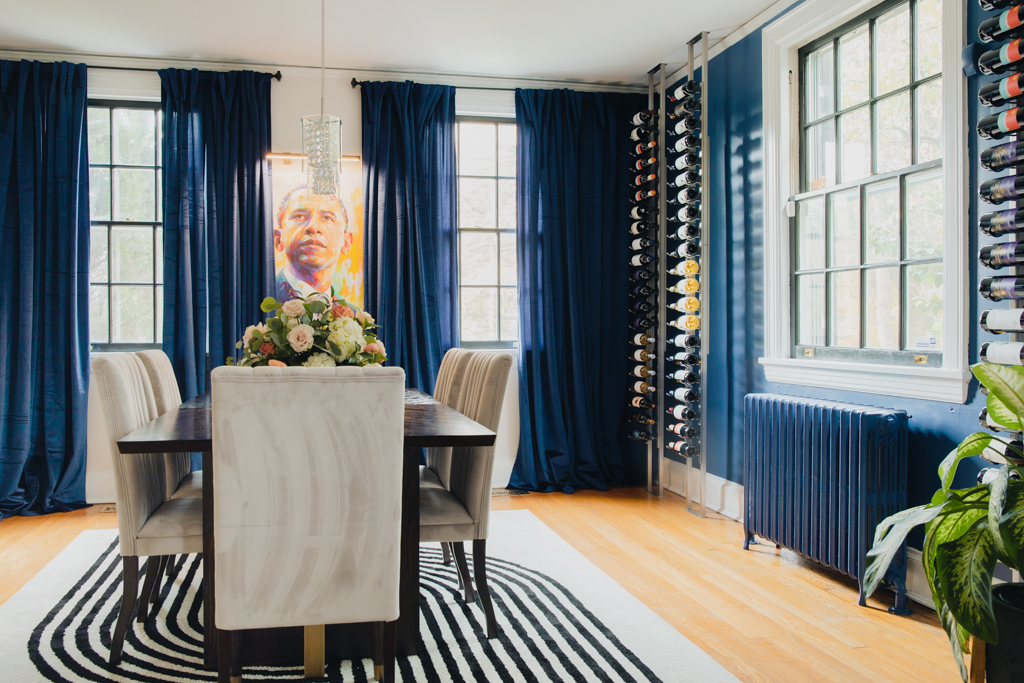 navy dining room with navy curtains and wine racks