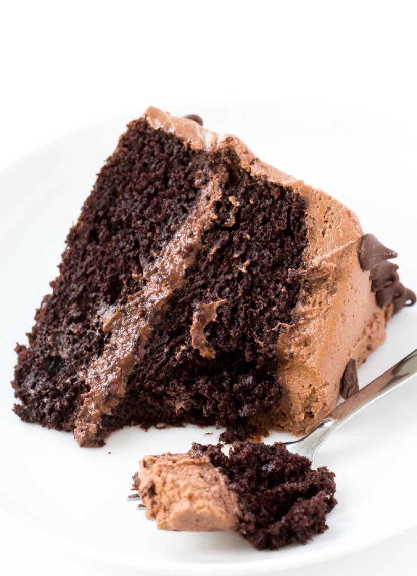 A bite of chocolate cake on a fork