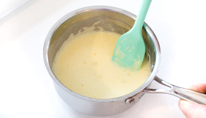 egg yolks and cream mixed together and heated in a small saucepan | chefsavvy.com