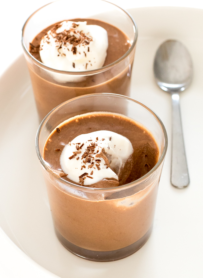 This 3-ingredient homemade chocolate mousse in two glasses topped with whipped cream and chocolate shavings | chefsavvy.com