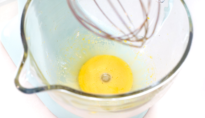 egg yolks mixed in a clear glass mixing bowl | chefsavvy.com