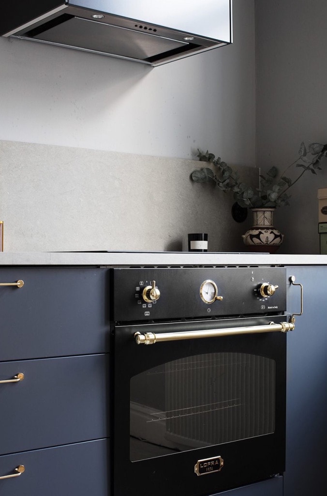 Blue kitchen with brass accents - via Coco Lapine Design blog