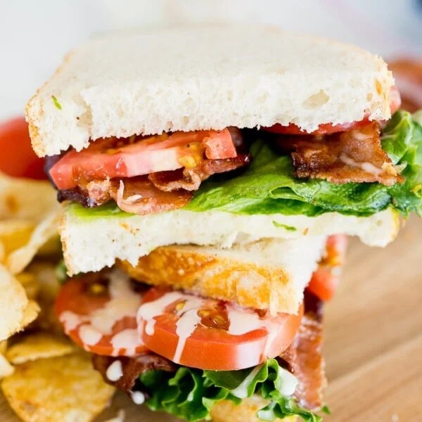 blt sandwich, made and cut in half.