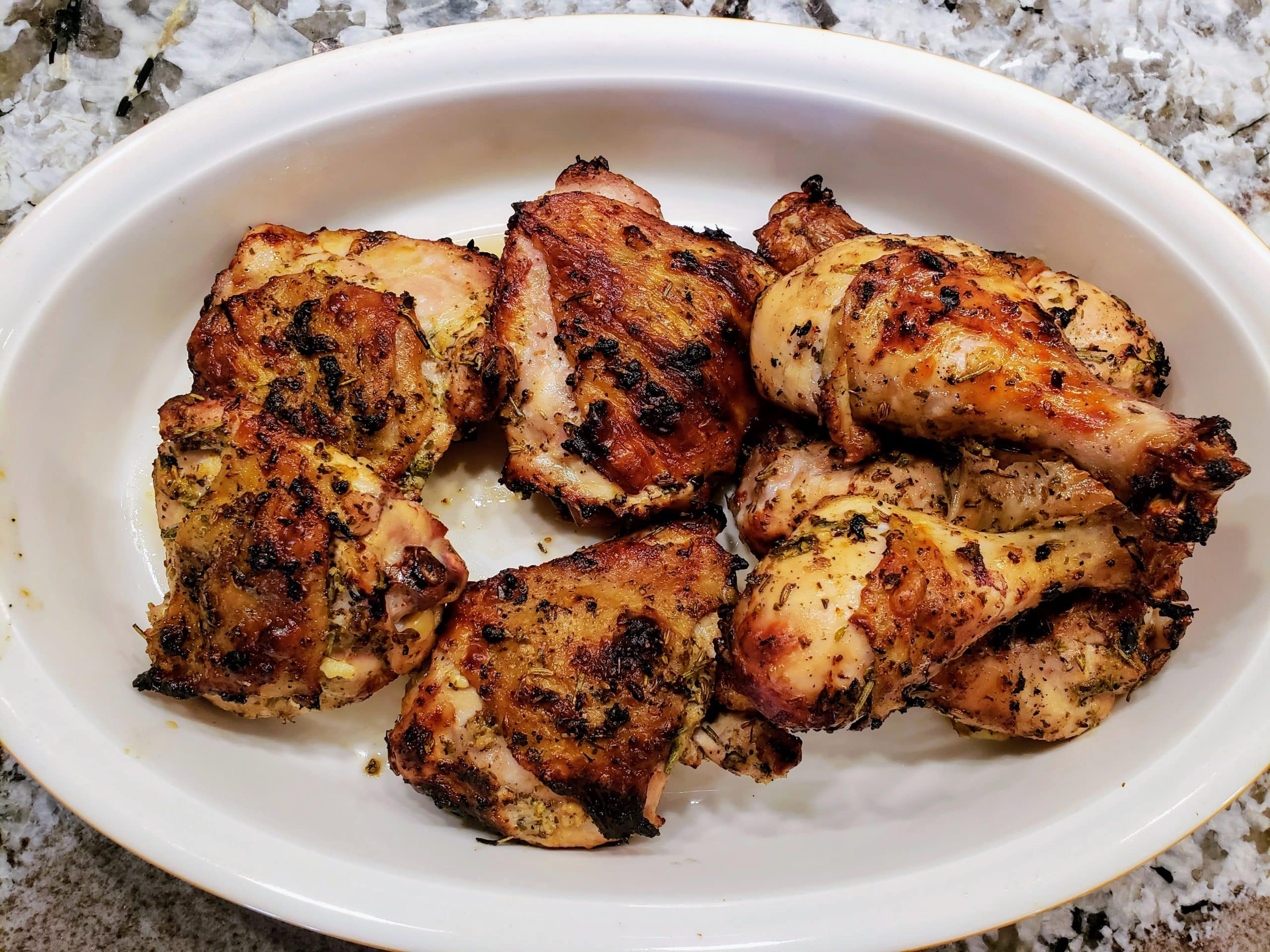 Mediterranean grilled chicken in a white dish