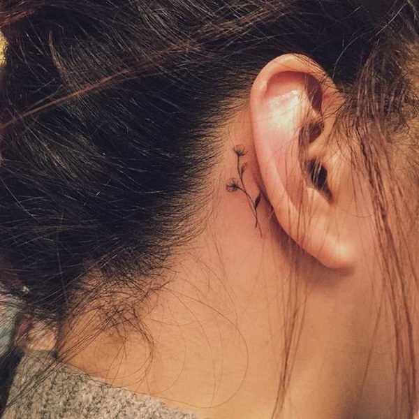 Minimalist cross behind ear