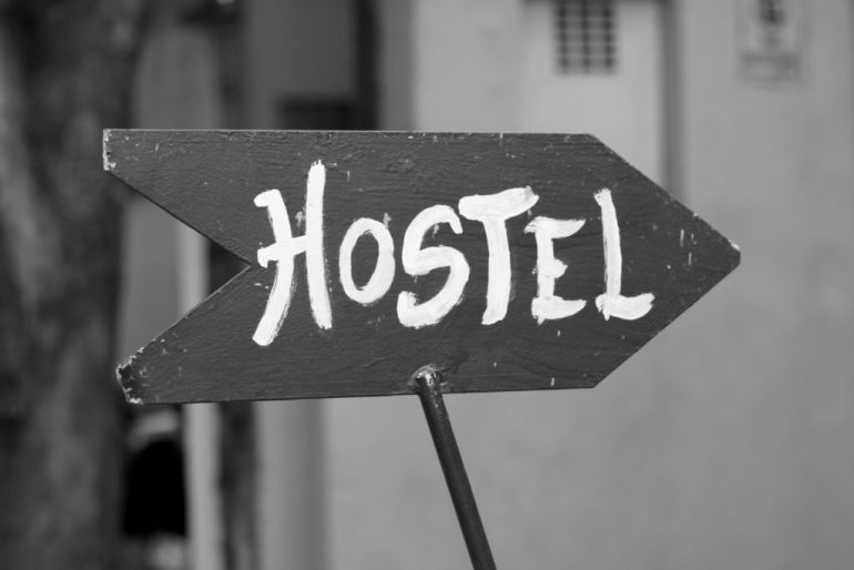 A sign pointing to a hostel