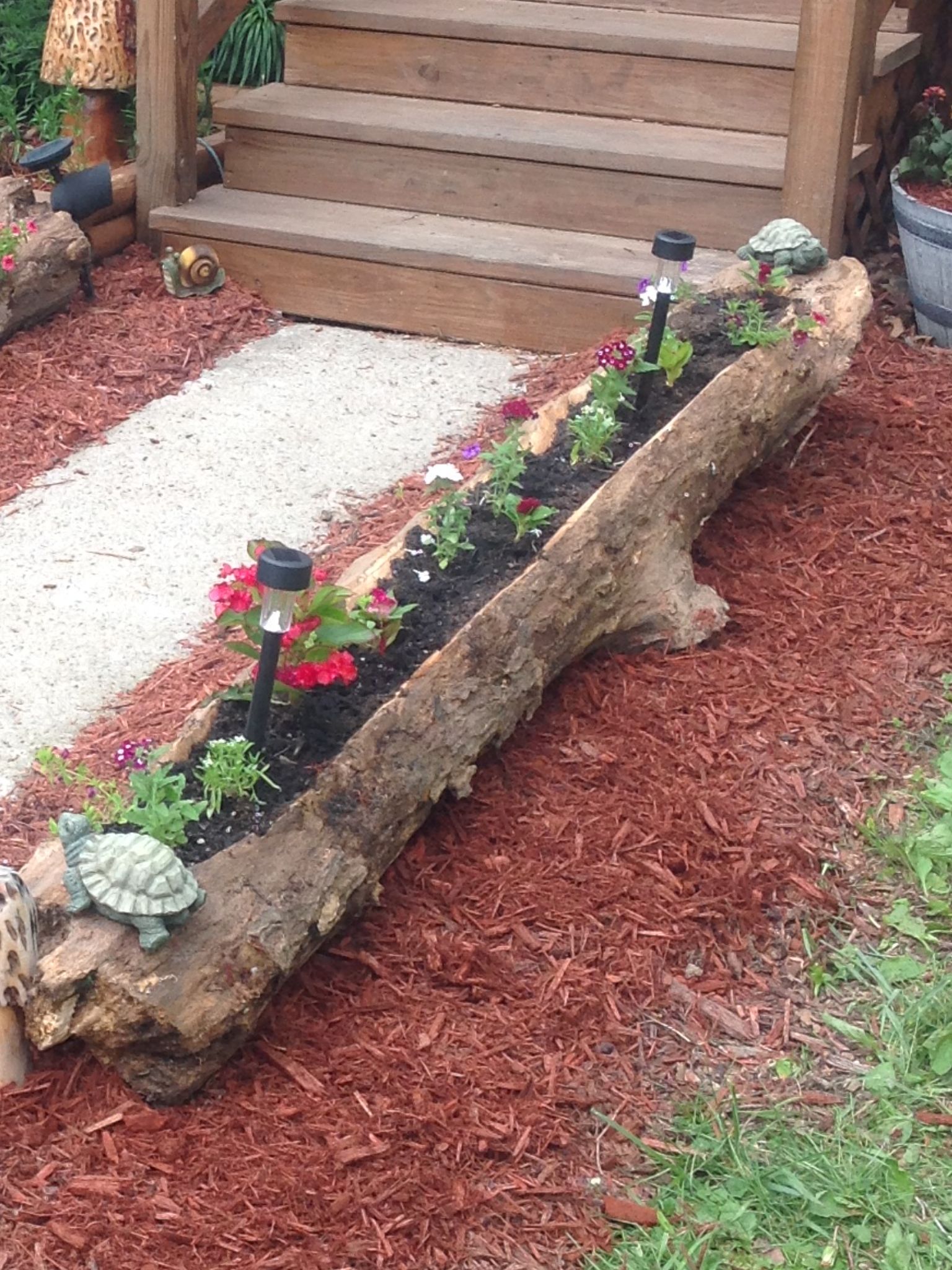 Log flower bed