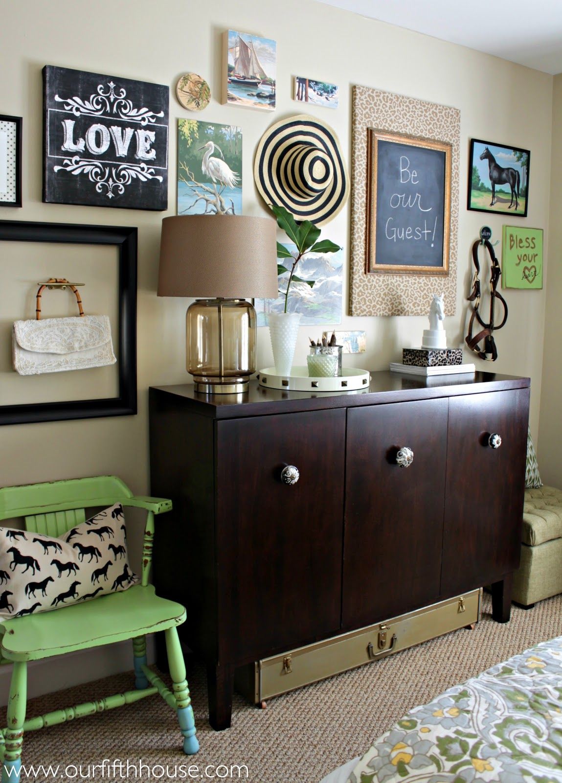 Guest room gallery wall with stylish storage