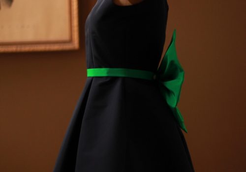 Dark Navy Silk Faille Pleated Junior Bridesmaid Dress with suede silk lining, open back, pockets, and emerald green big bow for wedding Bat Mitzvah interlining