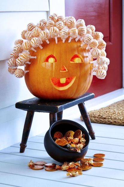 Creative carved pumpkin with candy treats