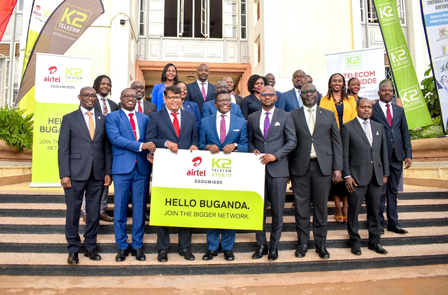 Airtel Uganda's Managing Director, Soumendra Sahu (3rd from left), Charles Peter Mayiga (center), the Katikkiro of Buganda, K2 Telecom's Managing Director, Arthur Mawanda (3rd from right) and other officials from the Buganda Kingdom, Airtel Uganda, and K2 Telecom pose for a group photo after Airtel Uganda and K2 Telecom renewed their partnership. Courtesy Photo