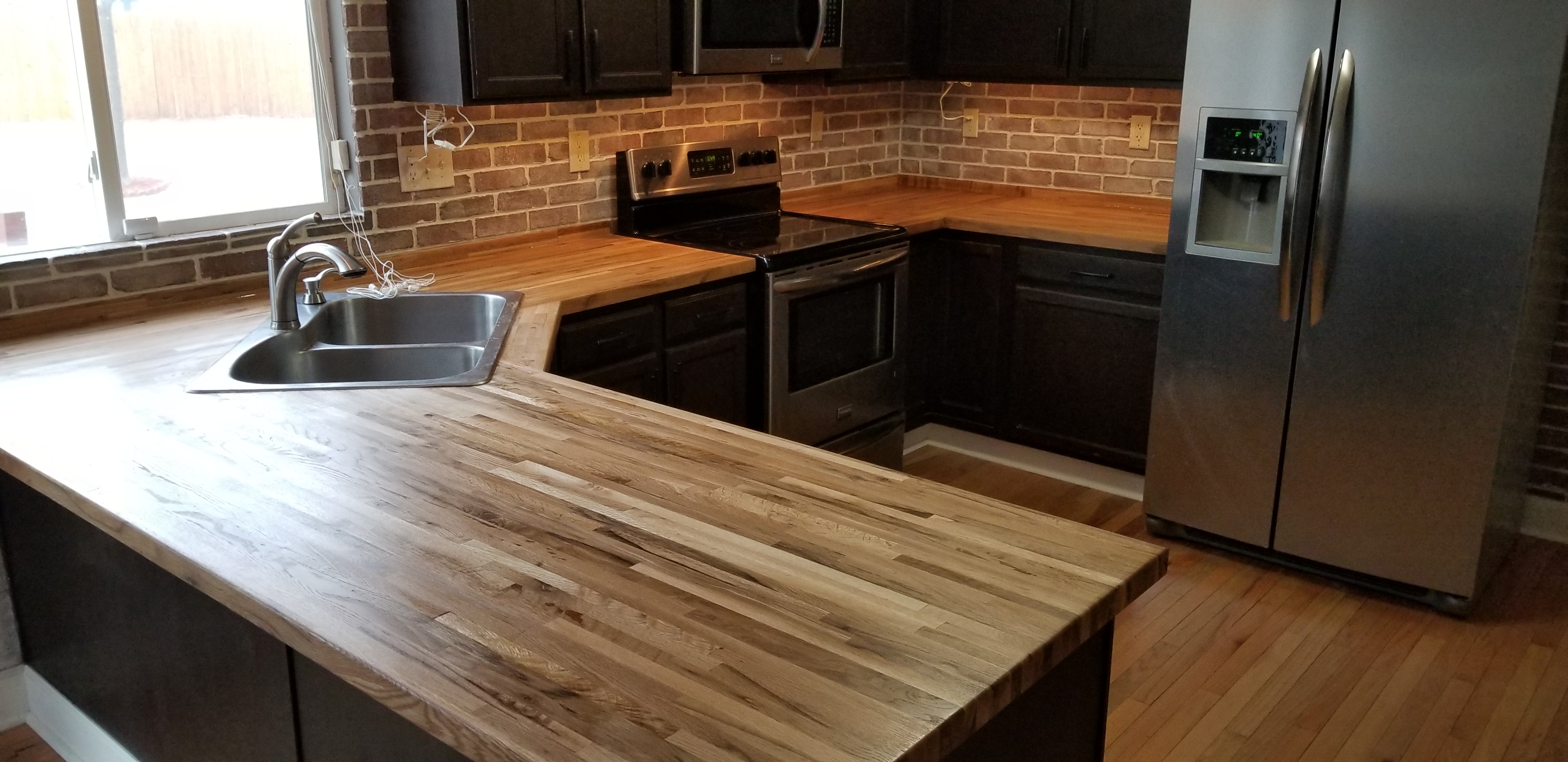 Faux Brick Backsplash and Butcher Block Countertops Peak Professional