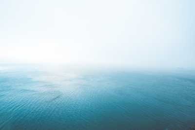 Blue Endless Ocean in Fog Free Photo