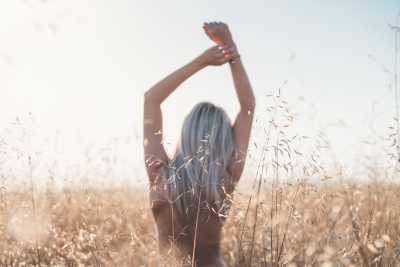 Young Woman Enjoying Freedom at Wheat Field Free Photo