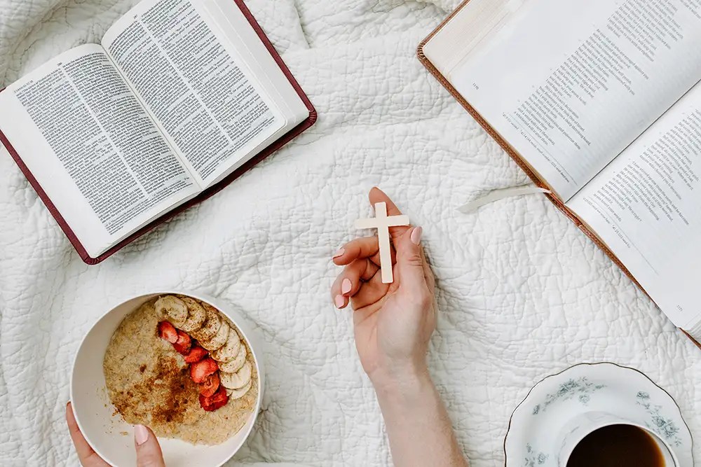 Breakfast and Bibles on bed.