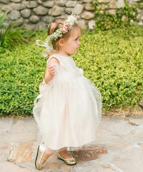 toddler's hairstyle with a floral headband