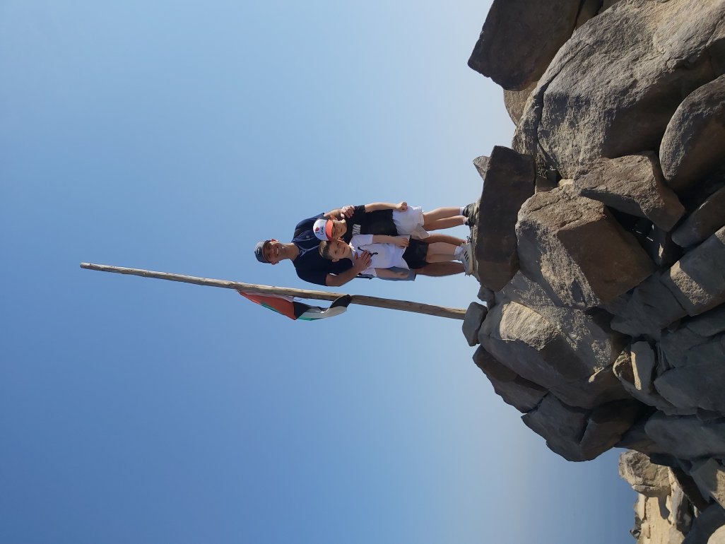 Dad and boys reached the summit on family hike in UAE.