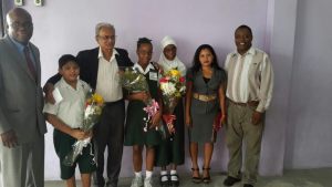 Minister of Education, Dr Rupert Roopnarine and others with the stop students. [iNews' Photo]