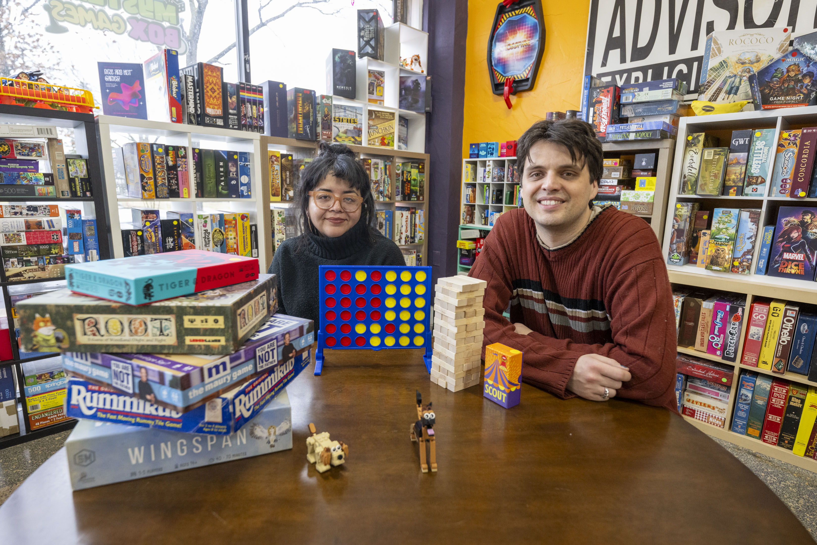 Babs Vasconez and Mikus Matiss on Saturday, March 9, 2024, show some of the games available to play at the Mystery Box Games in Easton, where they are the co-owners. (April Gamiz/The Morning Call)