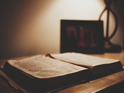 black and white book on brown wooden table