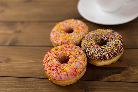 Fresh donuts and coffee cup