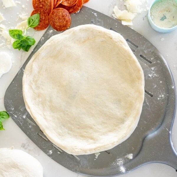 pizza dough on a pizza peel