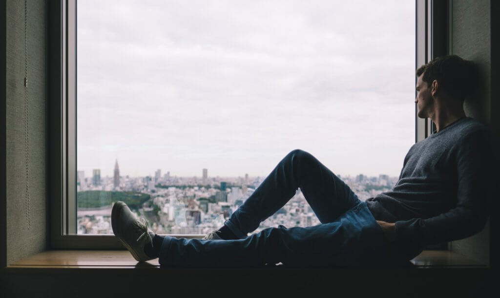 Lonely Man Looking Through Window