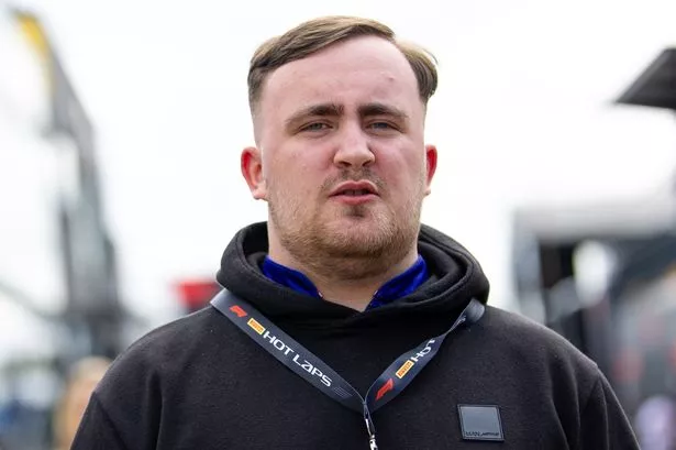 Professional darts player Luke Littler looks on in the paddock during previews ahead of the F1 Grand Prix of Great Britain at Silverstone Circuit on July 4, 2024 in Northampton, United Kingdom