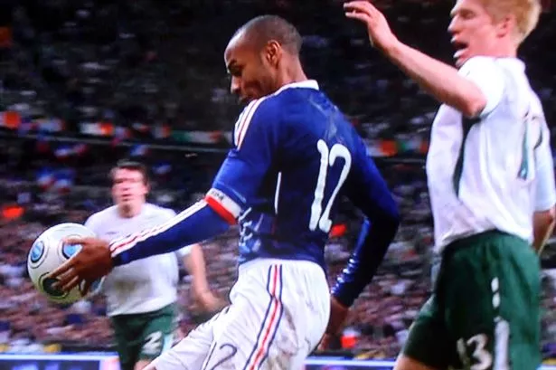 Henry clearly handles the ball on way to French goal